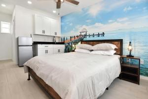 a bedroom with a bed with a view of the ocean at Blue Mist Motel - Room # 5 in Daytona Beach