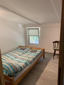 Ένα ή περισσότερα κρεβάτια σε δωμάτιο στο Cichy zakątek