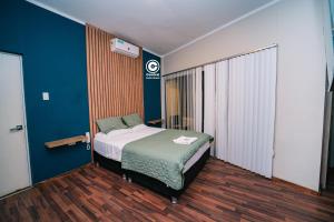 เตียงในห้องที่ Tarapoto central suites