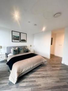 a bedroom with a large bed in a room at Opulent 3 -Bedroom Penthouse with Stunning Views in Newcastle upon Tyne