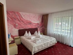 Postel nebo postele na pokoji v ubytování Casa Cioplea by Genco