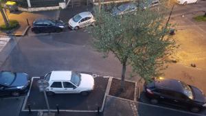 a group of cars parked in a parking lot at Appartement loft. A 2km de la colline d'Elancourt in Trappes