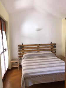 מיטה או מיטות בחדר ב-Casa Libeccio