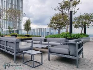 a group of chairs and tables in front of a building at Luxury Condo Paradox Santa Fe By Bamboo Skylife in Mexico City