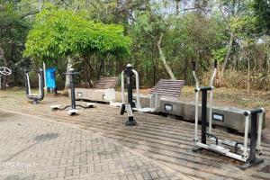 a row of exercise equipment on a boardwalk at Apartamento Fontana 3 in Bucaramanga
