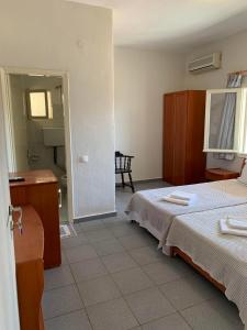 Postel nebo postele na pokoji v ubytování GR Apartments Sea View