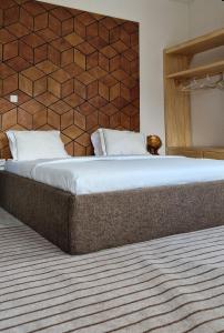 מיטה או מיטות בחדר ב-Appartements meuble SEED