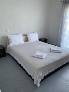 Postel nebo postele na pokoji v ubytování GR Apartments Sea View