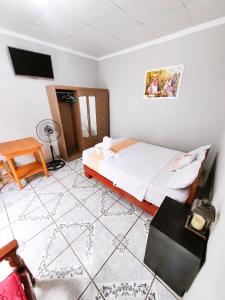 Un pat sau paturi într-o cameră la Tengana Hospedaje y Tours