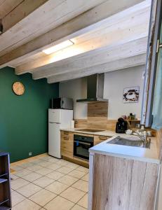 a kitchen with a sink and a counter top at La maison du 146 in Flavin