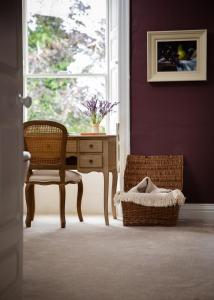 a room with a desk and a chair and a window at Mountrothe House in Kilkenny
