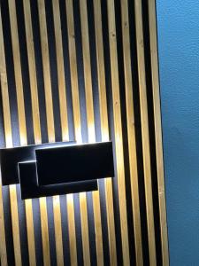 a close up of a black object on a wall at La balena bianca house in Bagni San Filippo