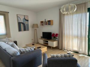 Telewizja i/lub zestaw kina domowego w obiekcie Clara's sun apt