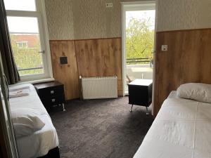 Letto o letti in una camera di Flex-Inn