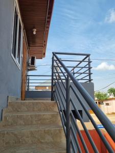 a set of stairs leading up to a house at Cozy Escape in Accra by Manna Hospital in Accra