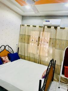 Ένα ή περισσότερα κρεβάτια σε δωμάτιο στο Seïf Industry's