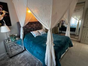 a bedroom with a bed with a canopy at Villa Studio44 a Luxury villa in Benissa Costa, max 8 guests, great pool, 700 m2 in Benissa +56 photos