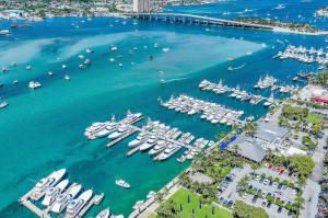 an aerial view of a marina with boats in the water at Dog friendly condo with beach access, hot tub, firepit in West Palm Beach