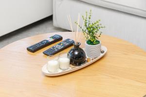 a table with a tray with candles and remote controls at Villa Giannari in Stalos