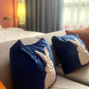 Postel nebo postele na pokoji v ubytování Shanlin INN