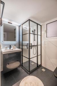 a bathroom with a shower and a sink at Charmant in Athens
