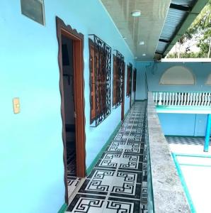 a hallway of a house with a swimming pool at Hotel Alto Amazonas in Leticia