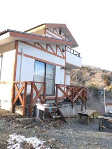 a house with a picnic table and a bench at Tenten Go Shibukawa - Vacation STAY 41129v in Ono