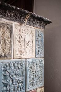 a stone pillar with intricate designs on it at Casa Fratomari - the Alpine dream in Lombro