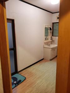 a room with a bathroom with a sink and a mirror at Kotohi - Vacation STAY 16047 in Kyotango