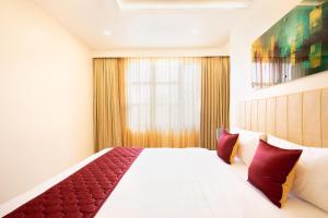 Postel nebo postele na pokoji v ubytování Hotel Merrytale