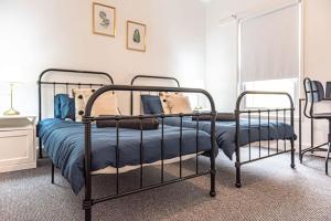 a bedroom with a bed with a blue comforter at Liverpool city centre house, Free parking in Liverpool