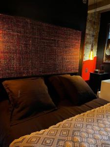Postel nebo postele na pokoji v ubytování Gîte Sept Fontaines * Jacuzzi & Sauna