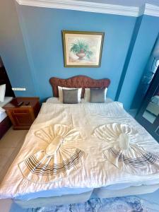 מיטה או מיטות בחדר ב-Sultanahmet Raydon Old City Hotel