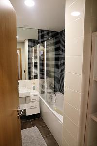 a bathroom with a tub and a sink and a shower at Apartamento Lux 1882 in Figueira da Foz