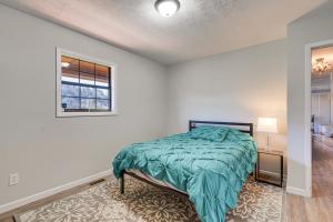 a bedroom with a bed and a window at Pet-Friendly Countryside Haven Near Cherokee Lake! in Rogersville