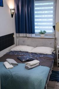 Katil atau katil-katil dalam bilik di Apartment L'Orque