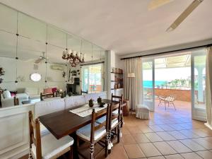 a kitchen and dining room with a table and chairs at Cilento Rooftop in Agropoli