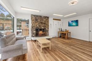 a living room with a couch and a fireplace at Ambassador Lake Tahoe in South Lake Tahoe