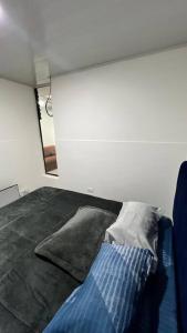 Ένα ή περισσότερα κρεβάτια σε δωμάτιο στο Apartamento en Teusaquillo