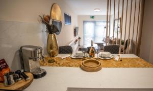 a kitchen counter with a coffee maker on a counter top at Spacious APT Romantic Getaway in Eastbourne