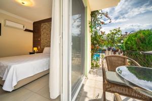 Postel nebo postele na pokoji v ubytování Dedeminn Garden Hotel + 37 fotografií