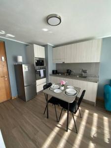 Una cocina o cocineta en Cómodo departamento céntrico