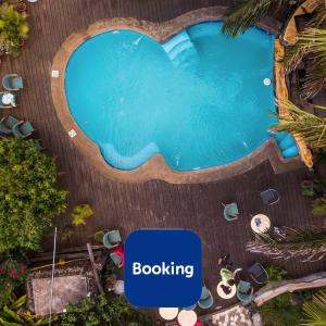 an overhead view of a swimming pool with the words boosing at Hotel Chez Maria Goretti in Hanga Roa
