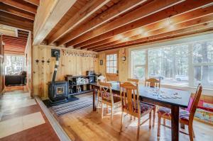 a dining room with a table and a stove at Spacious Classic Cabin Retreat- near Lassen in Mill Creek