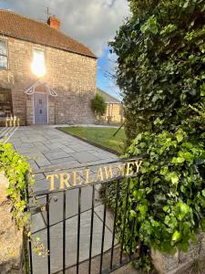 a iron gate with a sign that reads first anniversary at Bi-Folds/Sonos/Large Open Plan/Central/Parking in Cheddar