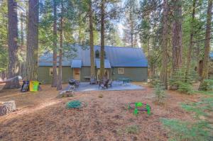 a cabin in the middle of the woods with trees at Spacious Classic Cabin Retreat- near Lassen in Mill Creek