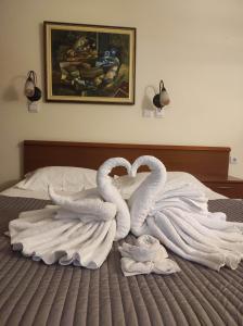 Ένα ή περισσότερα κρεβάτια σε δωμάτιο στο Garni Hotel Meduza