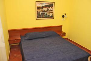 Ένα ή περισσότερα κρεβάτια σε δωμάτιο στο Garni Hotel Meduza