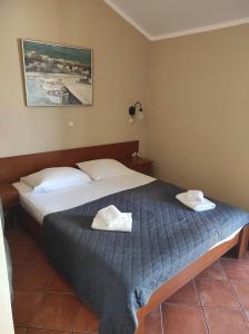 Ένα ή περισσότερα κρεβάτια σε δωμάτιο στο Garni Hotel Meduza