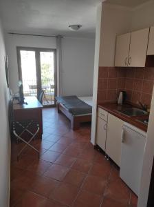 Η κουζίνα ή μικρή κουζίνα στο Garni Hotel Meduza